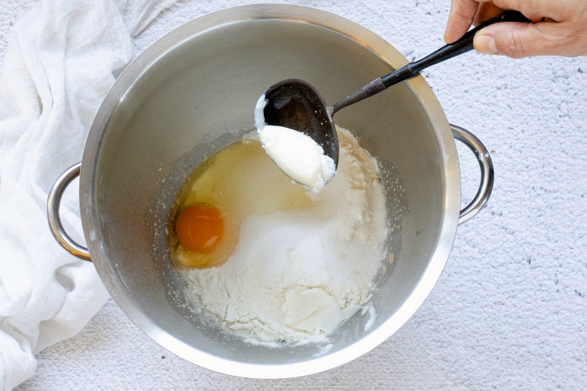Adding the butter to make the dough for the Mallorcan ensaimada