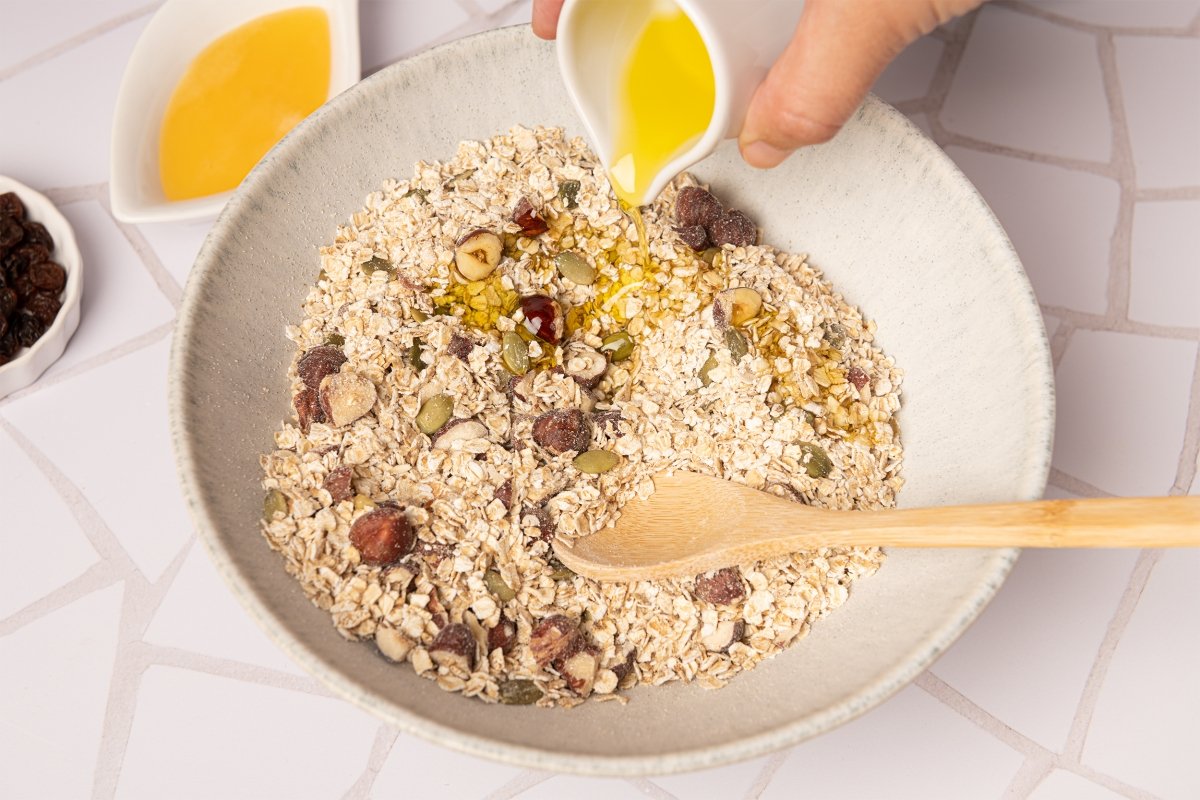 add the honey and oil to the homemade granola