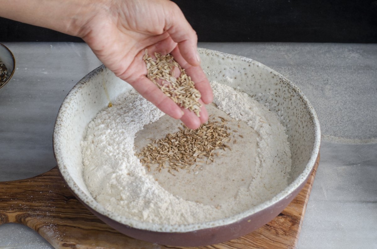 Add the seeds to the flour