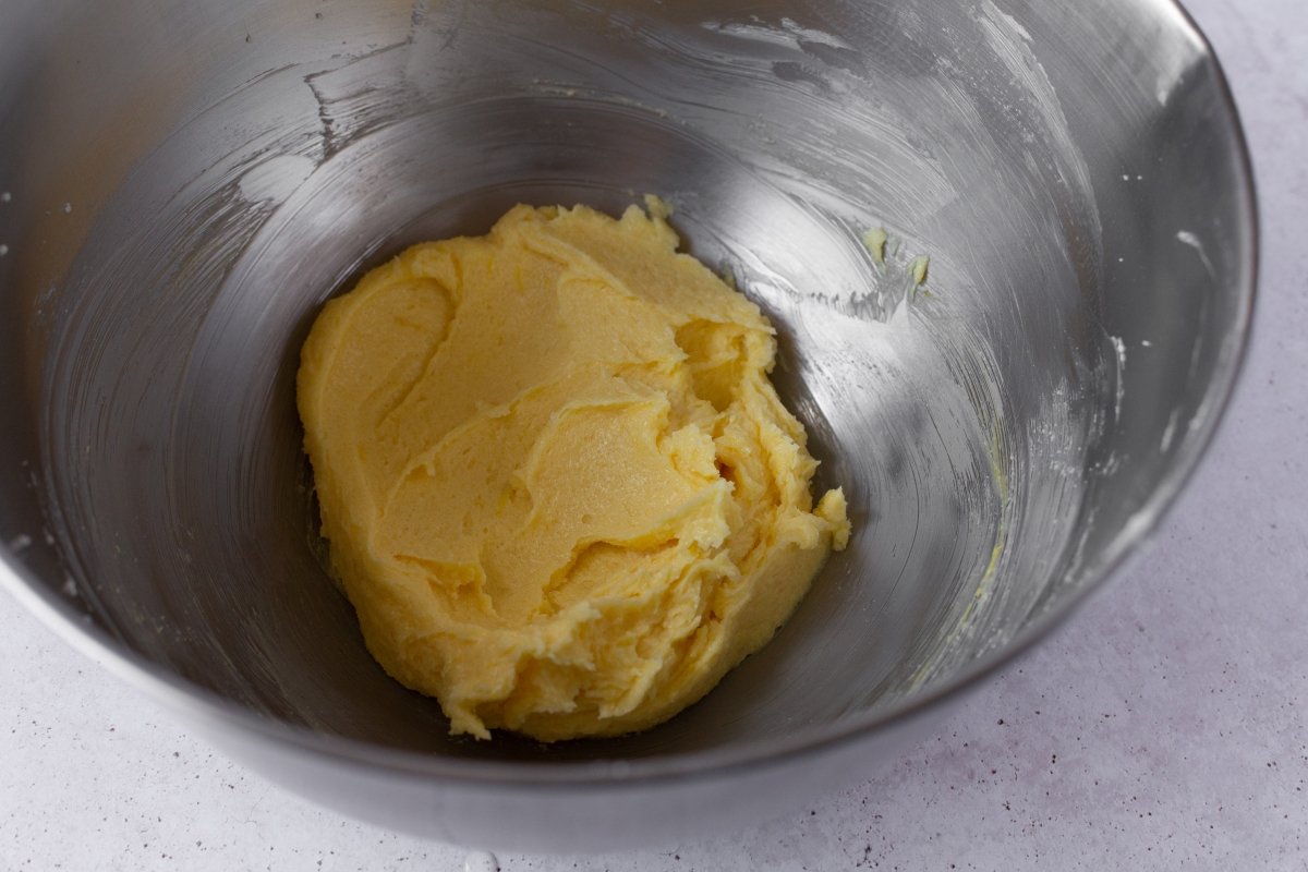 Add the yolk, zest and vanilla