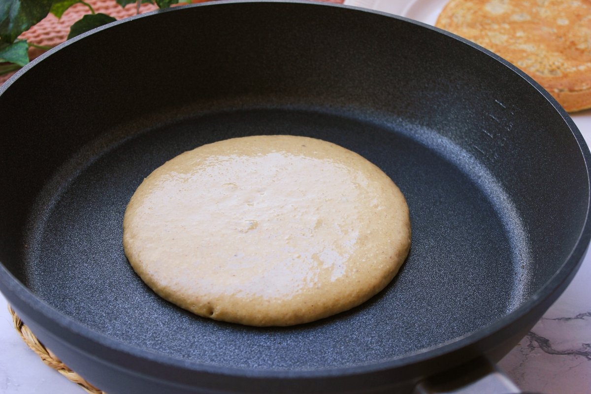 Pancake cooking on one side