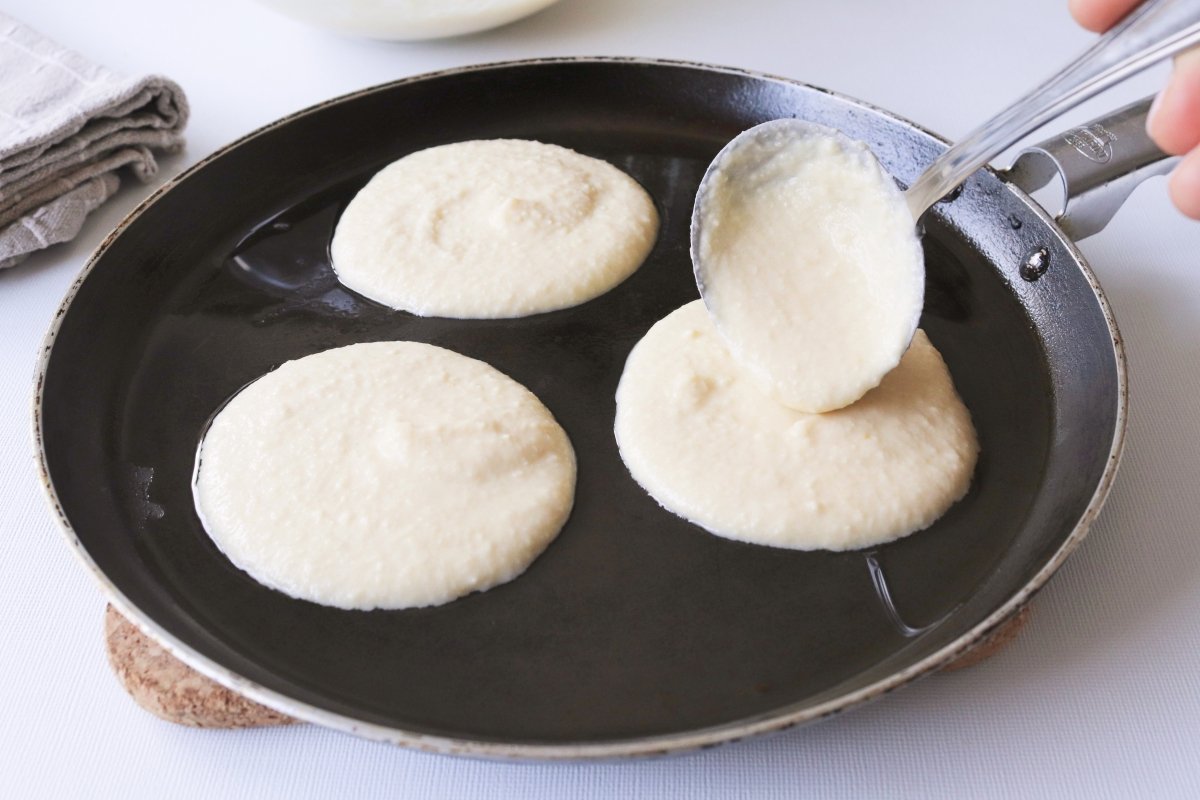 Cooking gluten-free pancakes in a frying pan