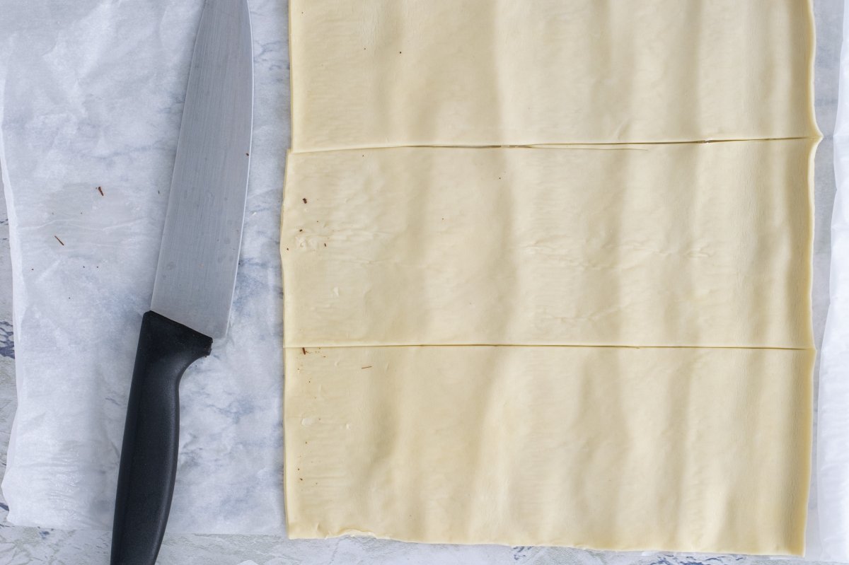 Cut strips of puff pastry for the chocolate napolitanas