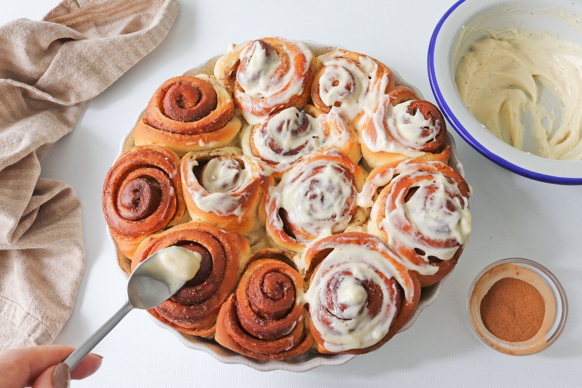 Cover the cinnamon rolls with frosting