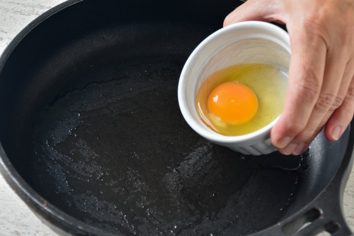 We put the egg in the pan