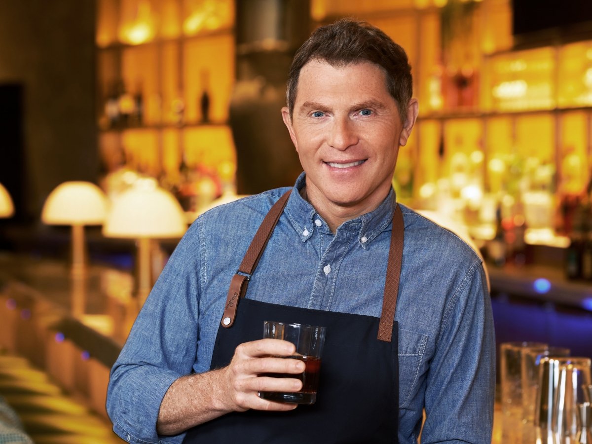 Chef Bobby Flay posing in his Amalfi restaurant