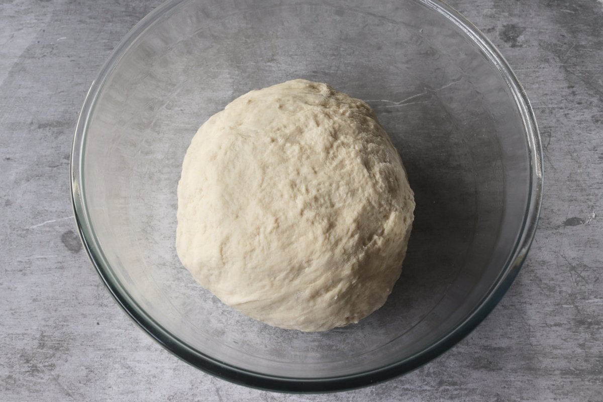 Grease a bowl and rest the dough for rustic wheat bread