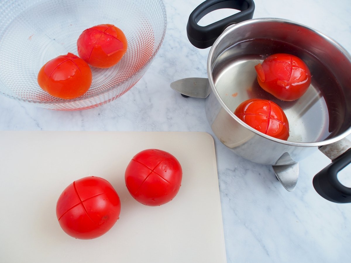 We scald the tomatoes in boiling water to peel them easily