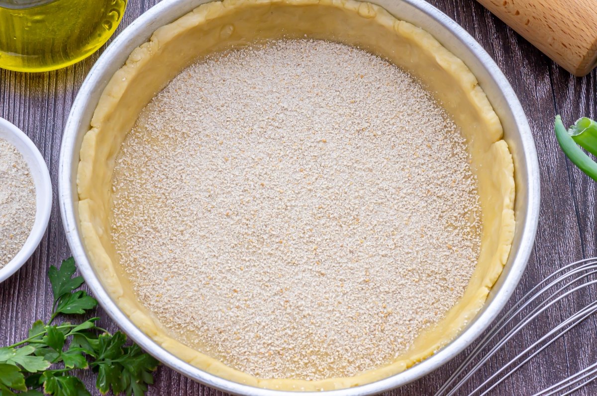 Sprinkle breadcrumbs over the base