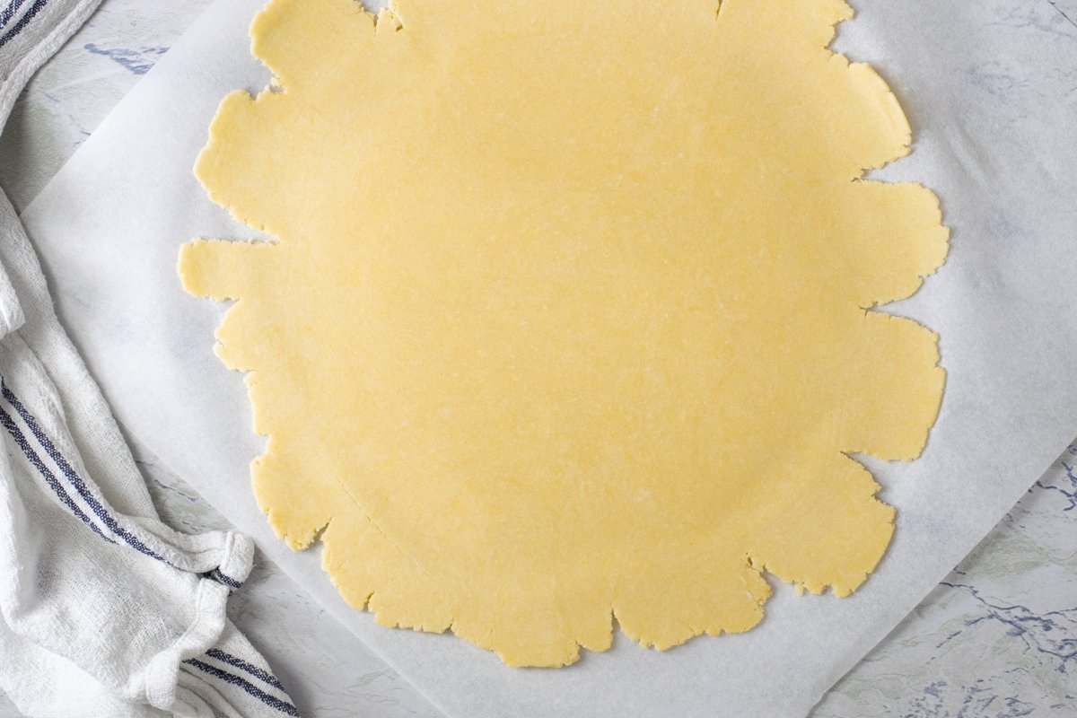 Roll out the dough for the lemon tart