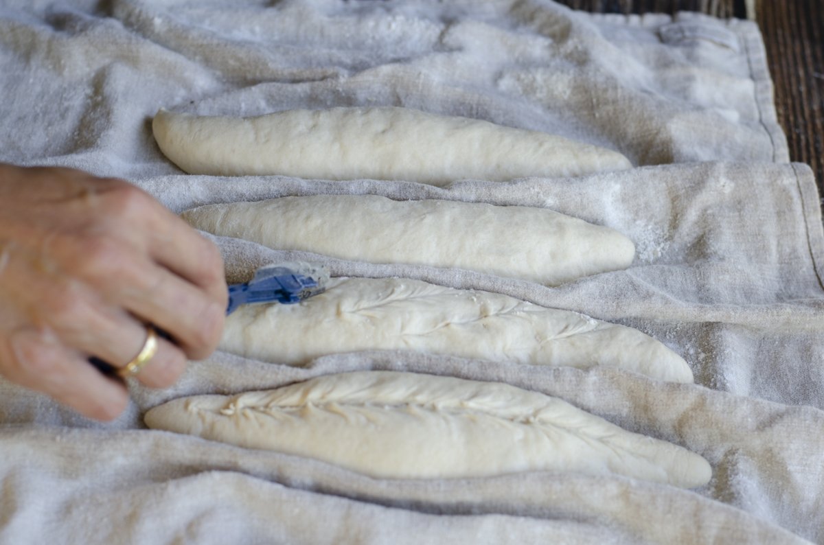 grinding the loaves of bread