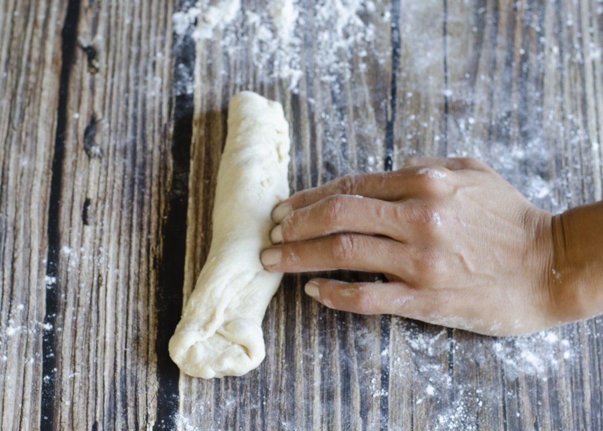 Making the second fold of the sandwich bread