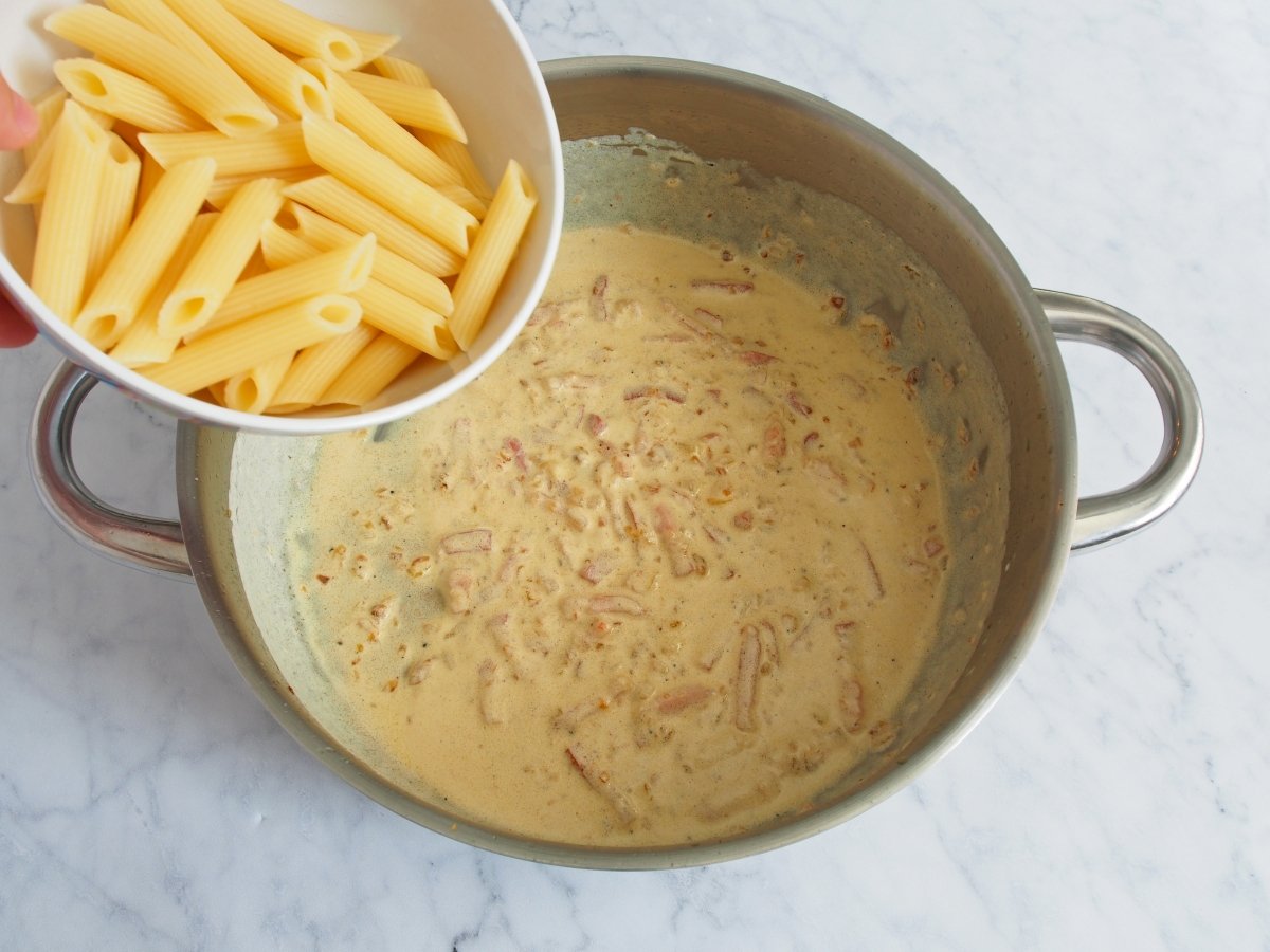Add the macaroni to the pan