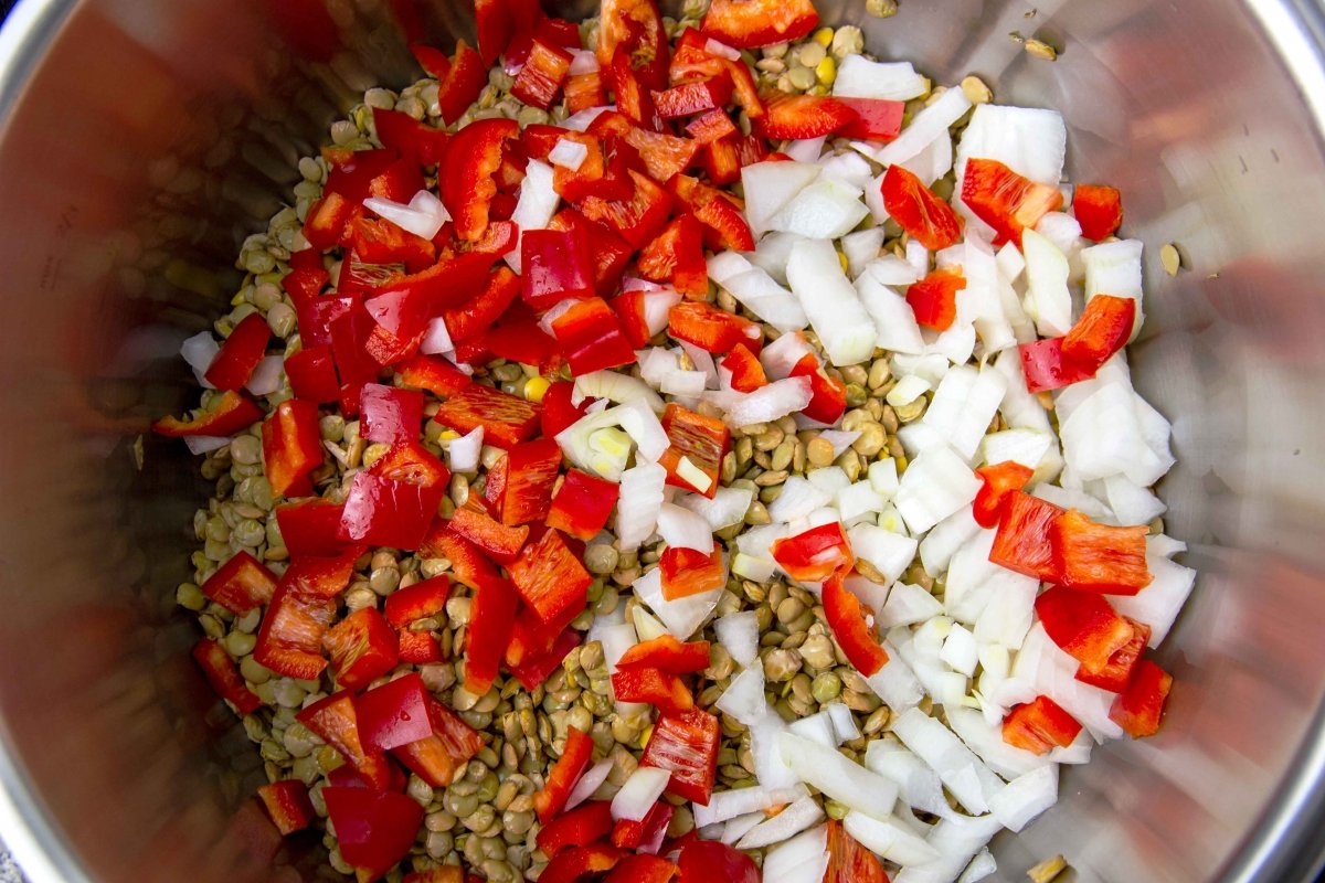 Add the peppers and onions to the lentil stew