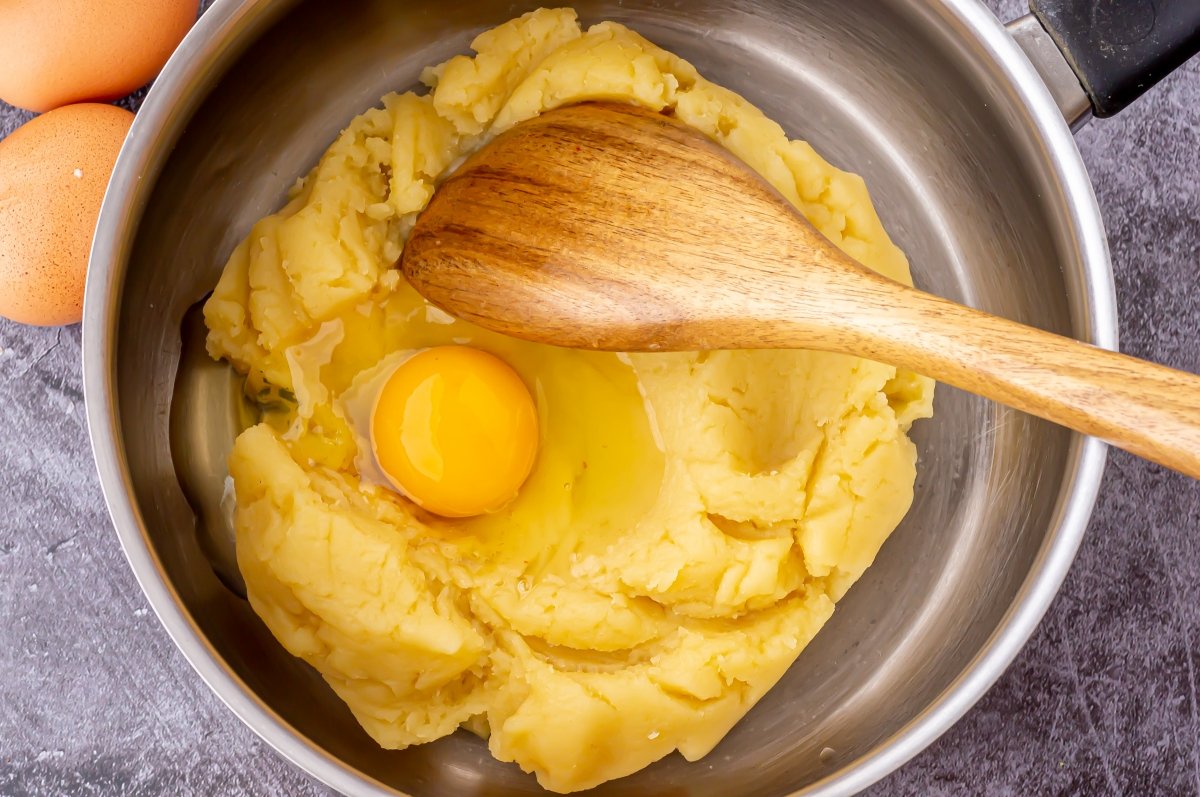 Add the eggs to the karpatka choux pastry