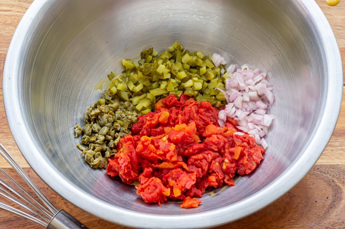 Add the chopped ingredients for the tomato tartare