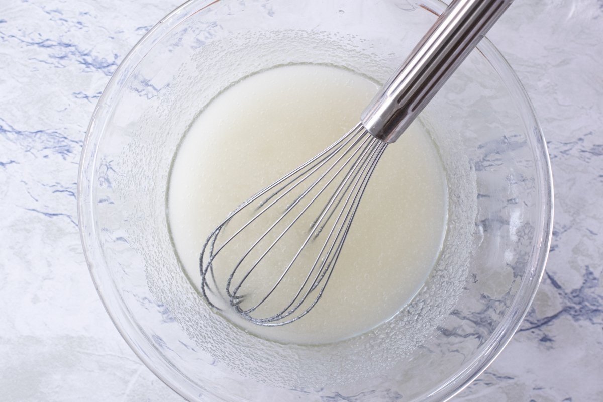 Mix the oil and sugar for the fondant birthday cake