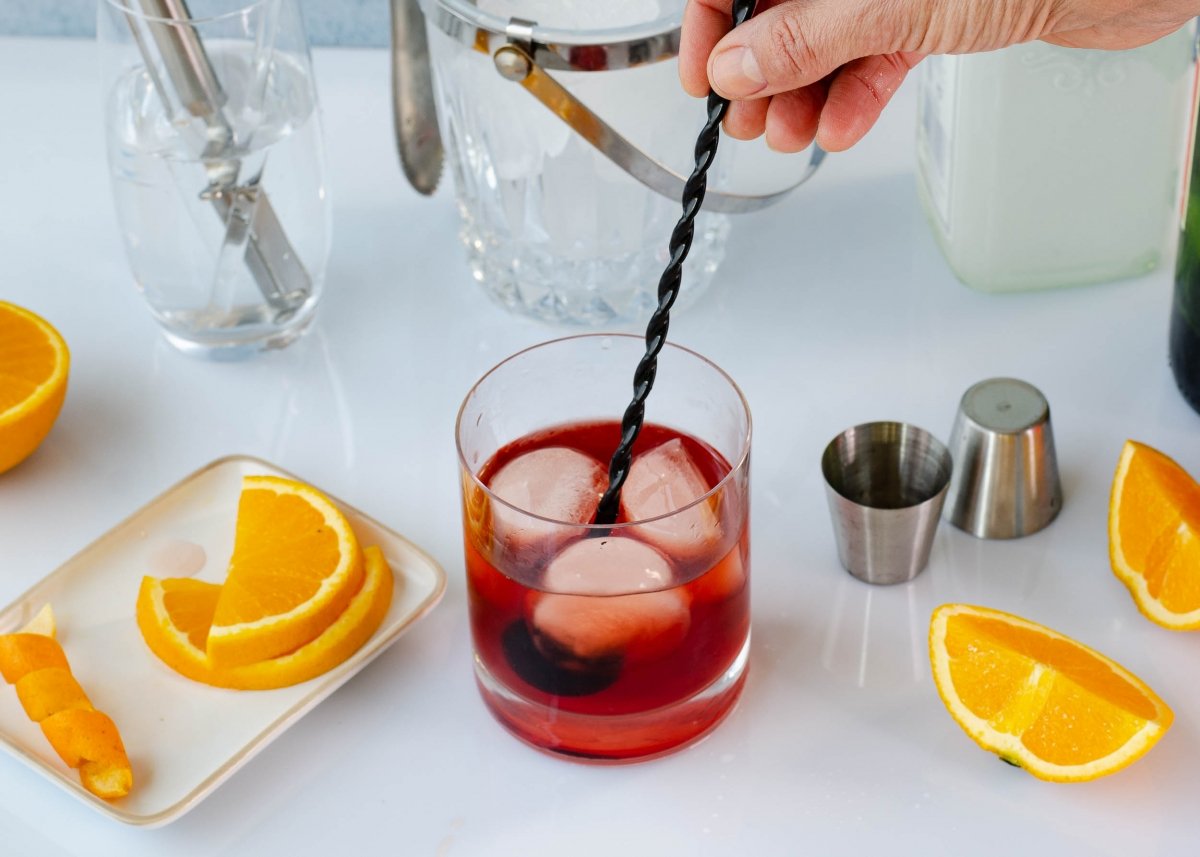 Mixing the negroni in the already prepared glass