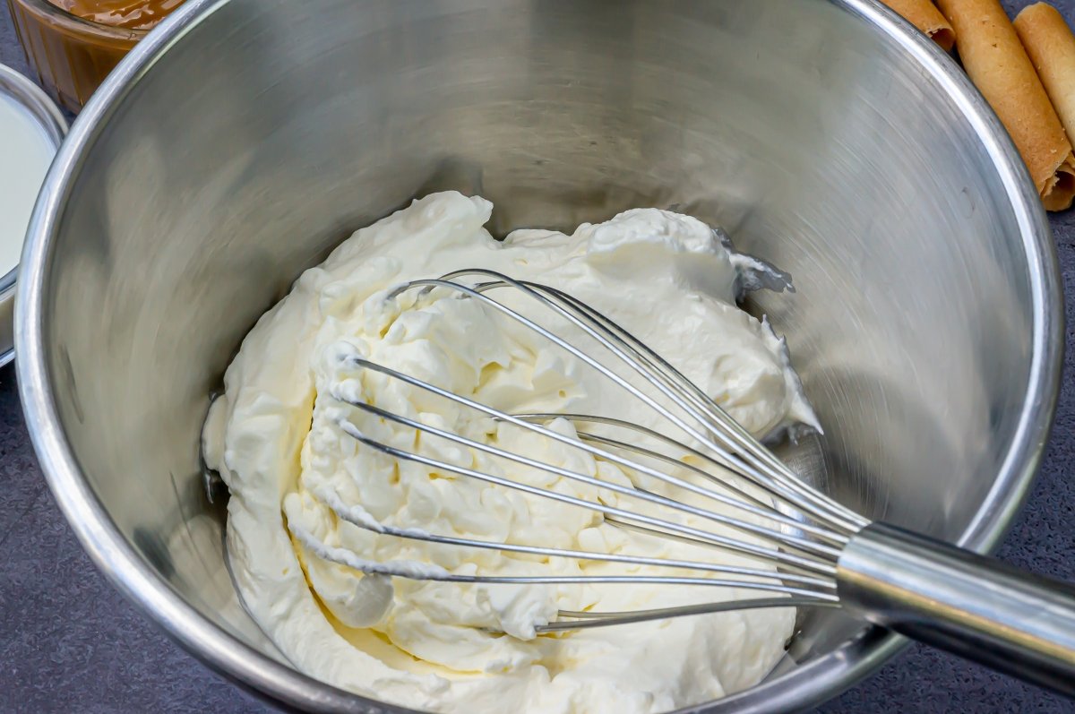 Whipping the cream for the dulce de leche ice cream