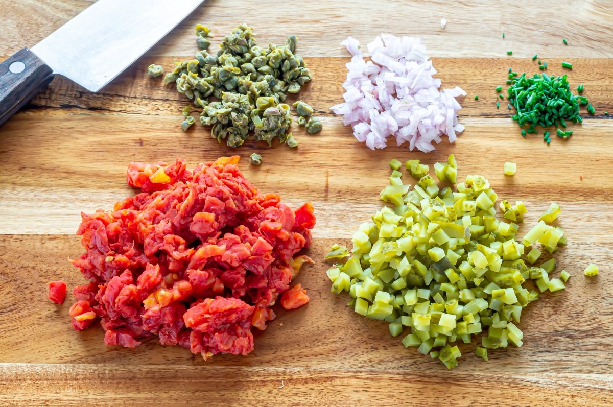 Chop all the ingredients for the tomato tartare