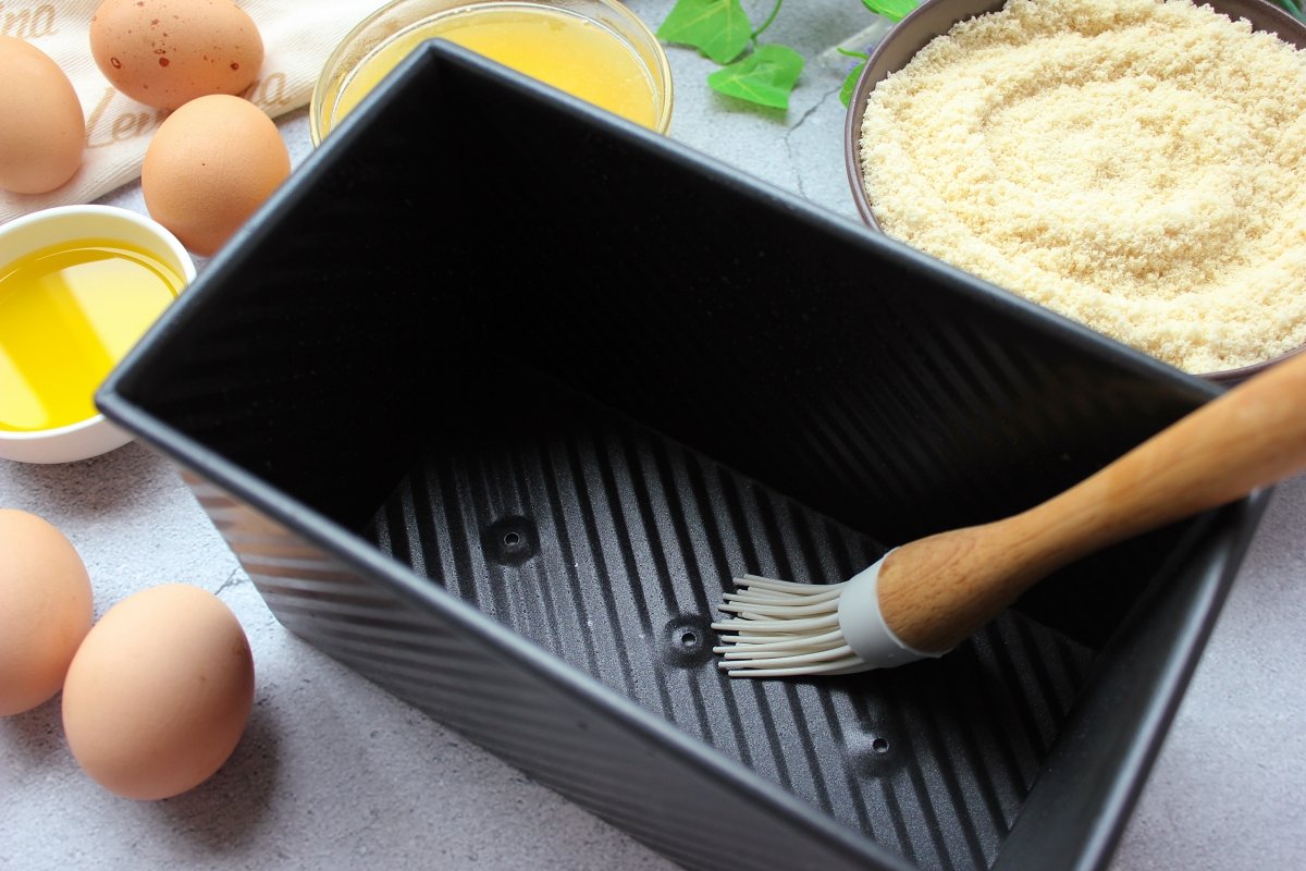 Brushing the keto bread pan with oil