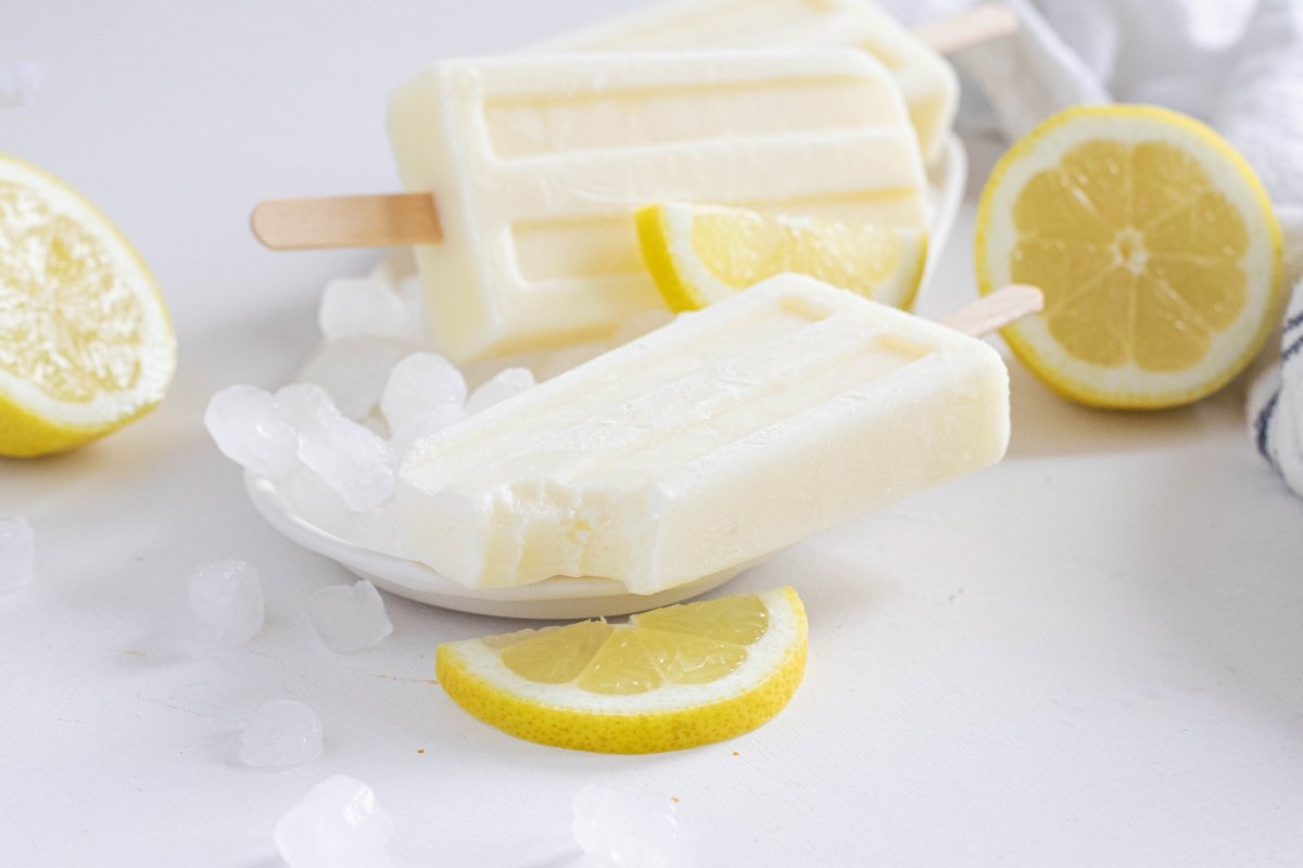 Condensed milk and lemon popsicles served on the plate