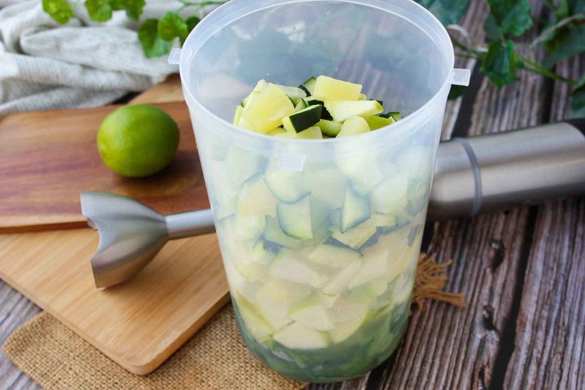 Container with all the green juice ingredients before blending