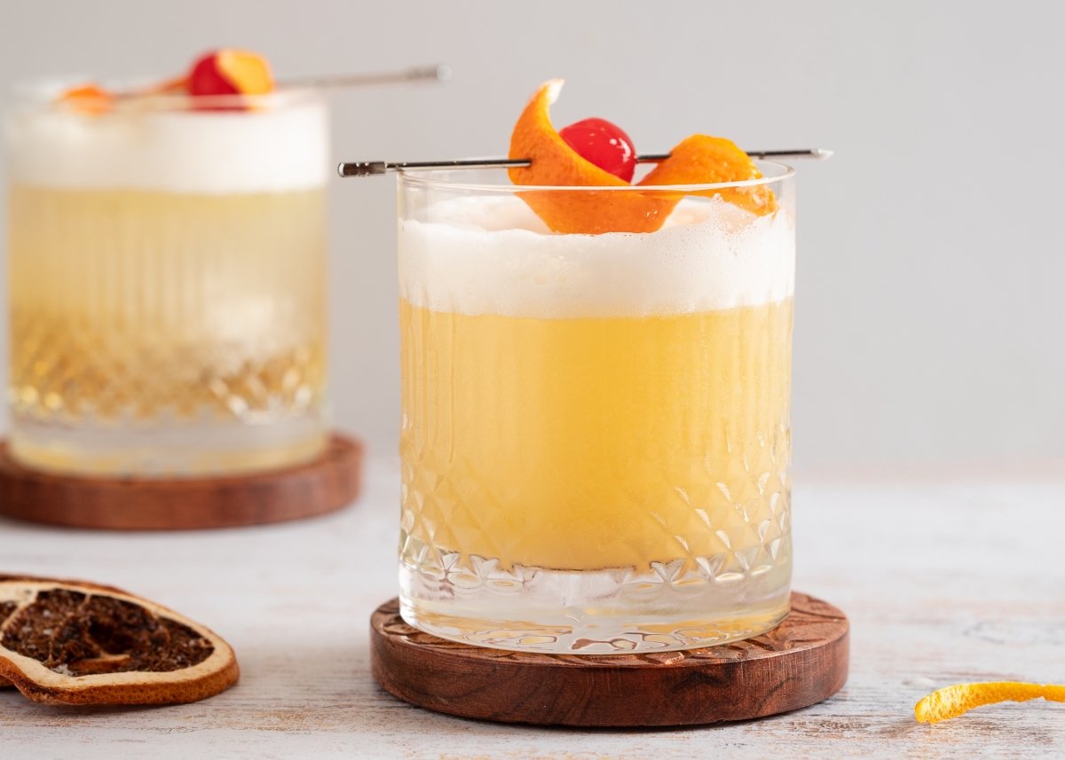 Remove the water from the whiskey sour glass