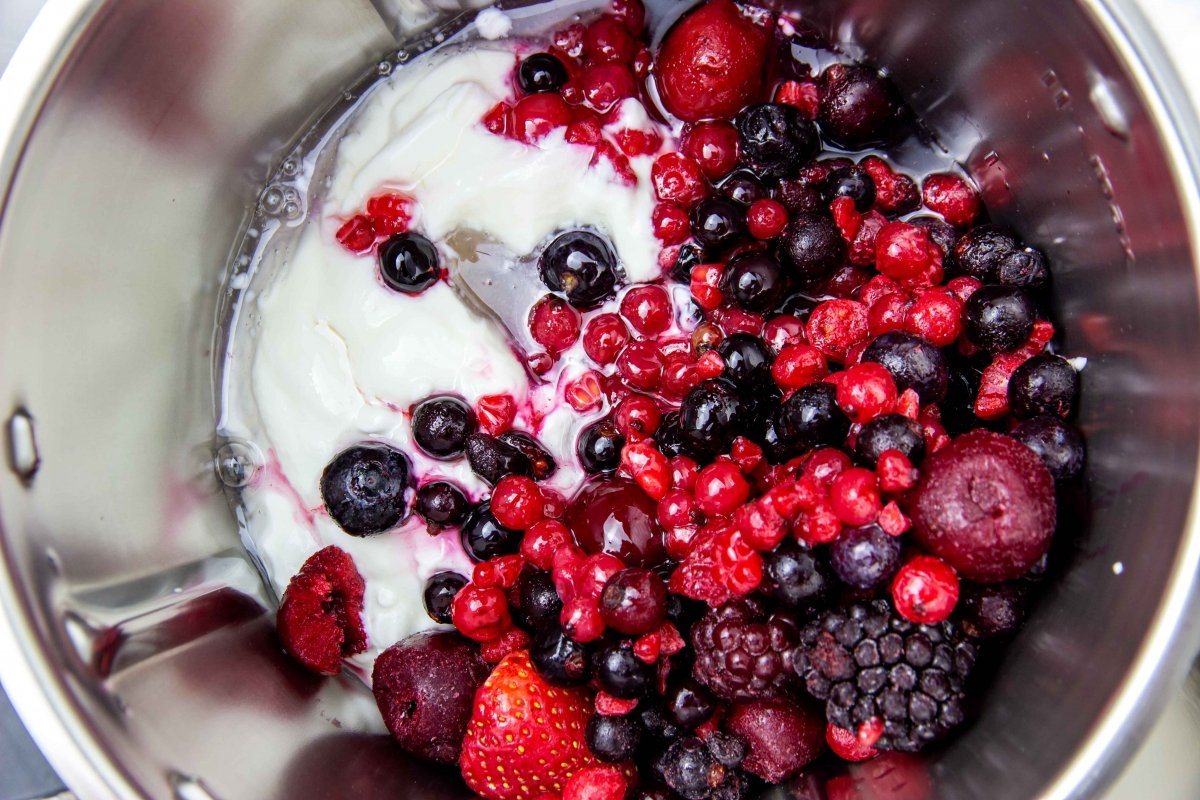 Crush ingredients to make yogurt and red fruit ice cream