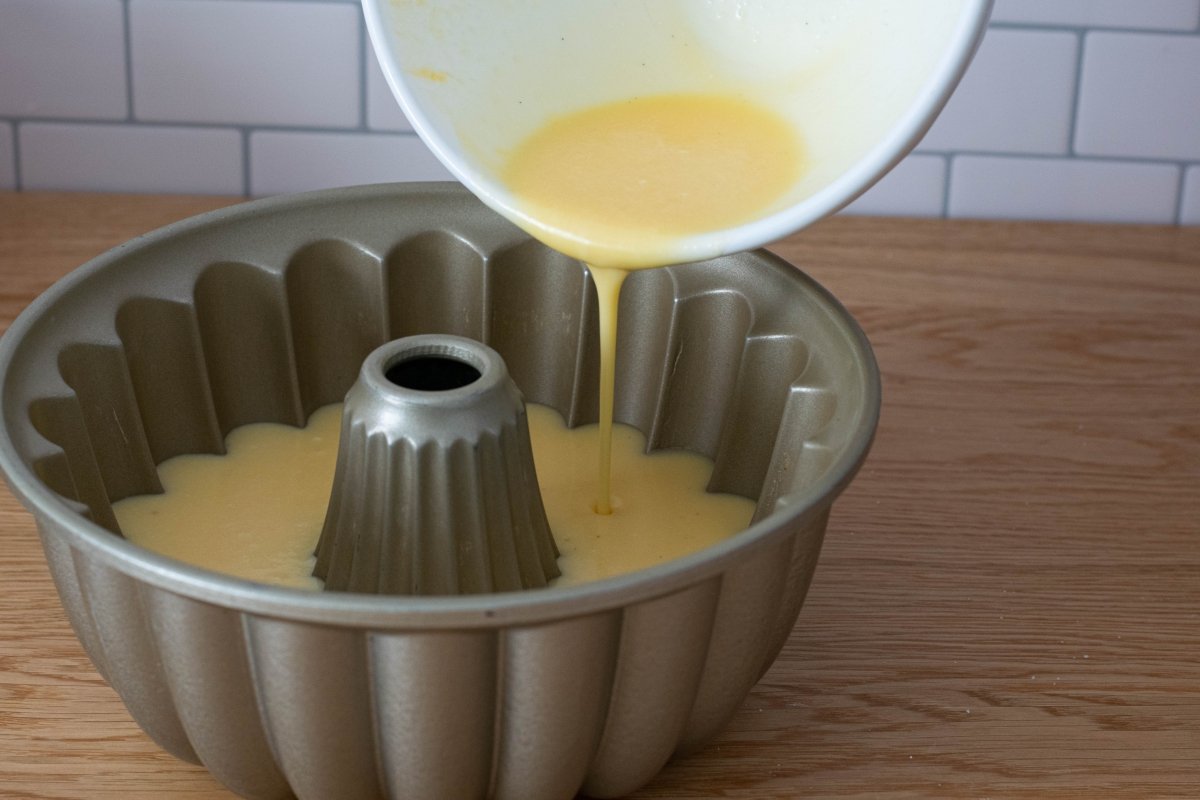 Pour the flan into the chocoflan mold