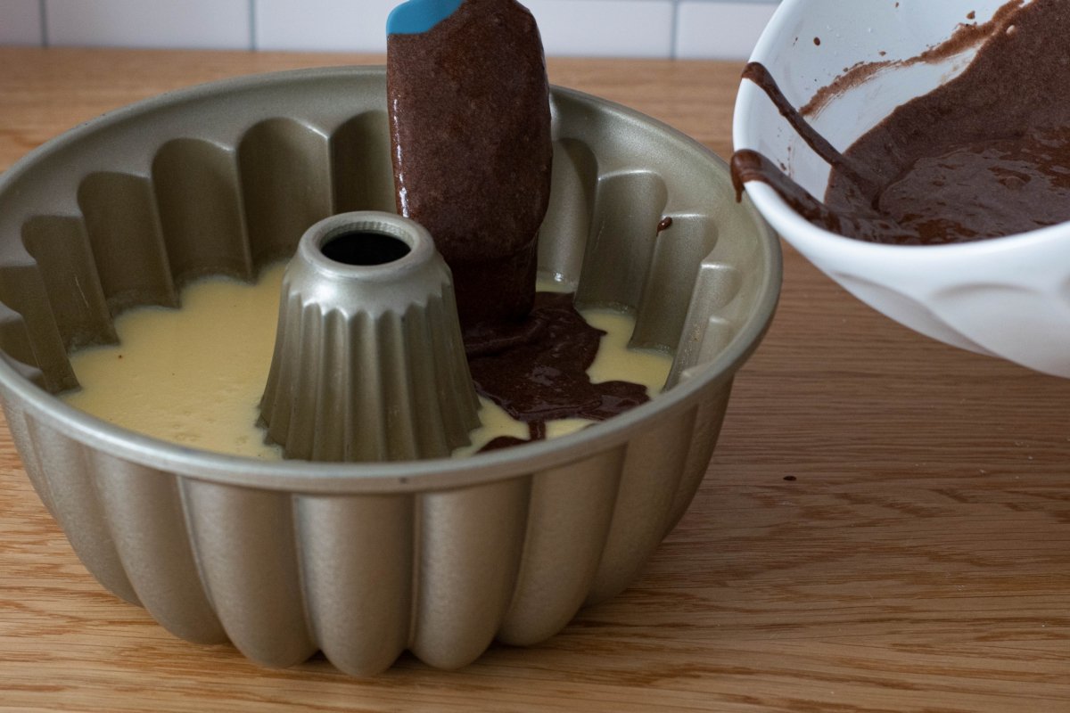 Pour the cake batter into the chocoflan mold