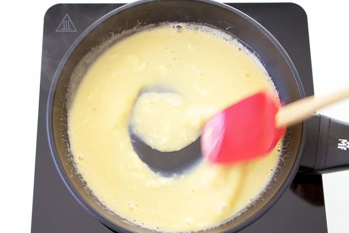 Pour the beaten egg into the pan