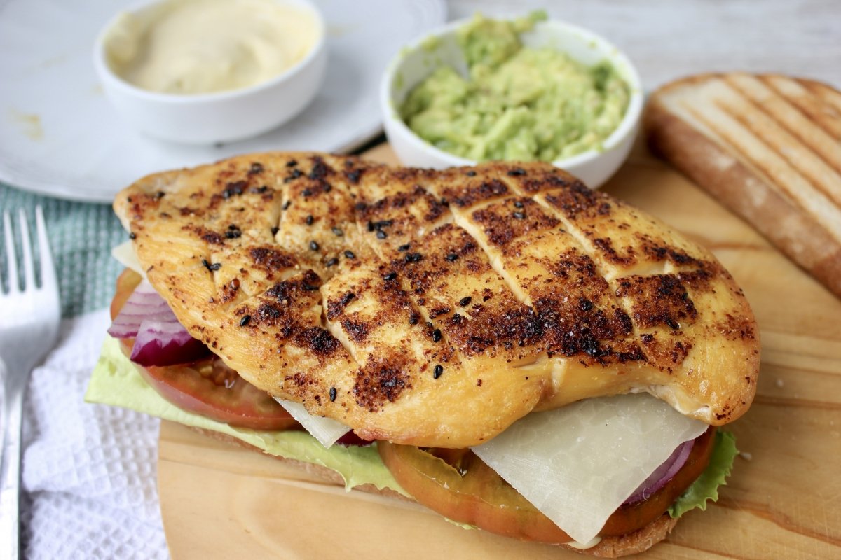 View of grilled chicken breast on the sandwich