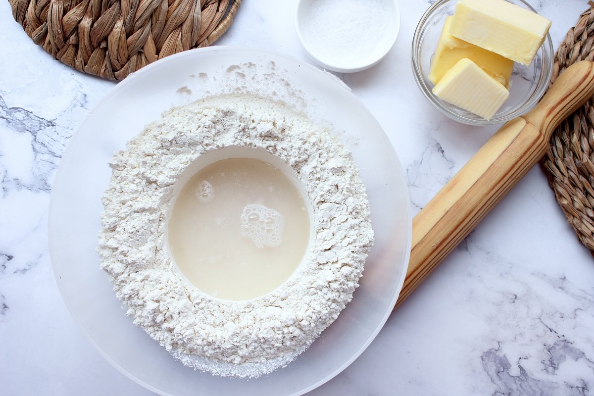 Flour volcano with water and yeast inside